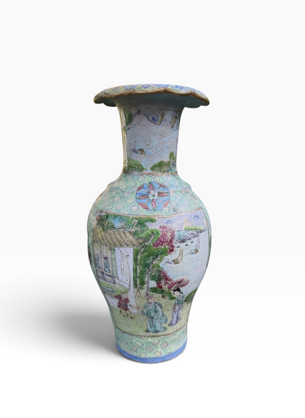 A pair of 19th-century Chinese Yixing stoneware baluster vases decorated in vibrant polychrome enamels with figural panels on a patterned green ground. View III