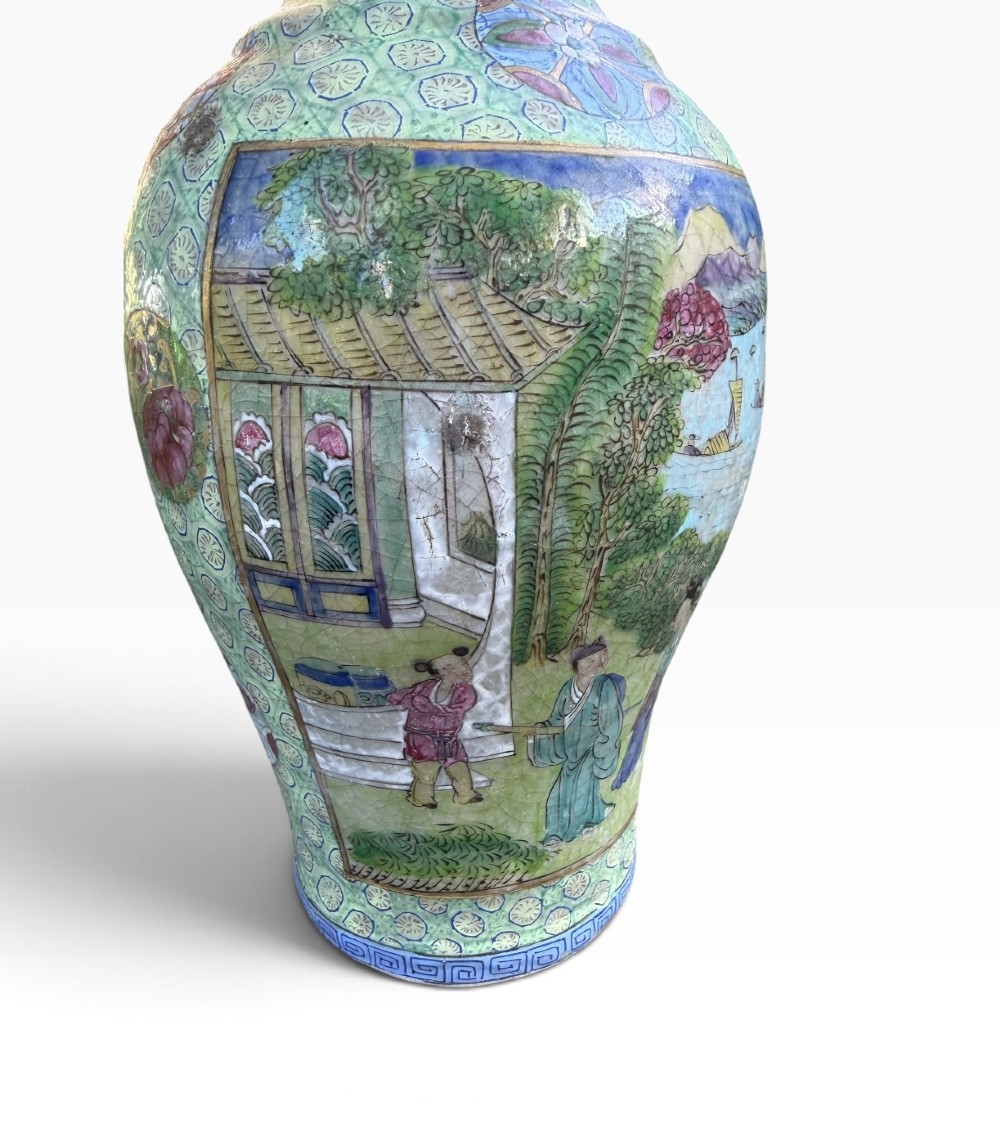 A pair of 19th-century Chinese Yixing stoneware baluster vases decorated in vibrant polychrome enamels with figural panels on a patterned green ground. View XI