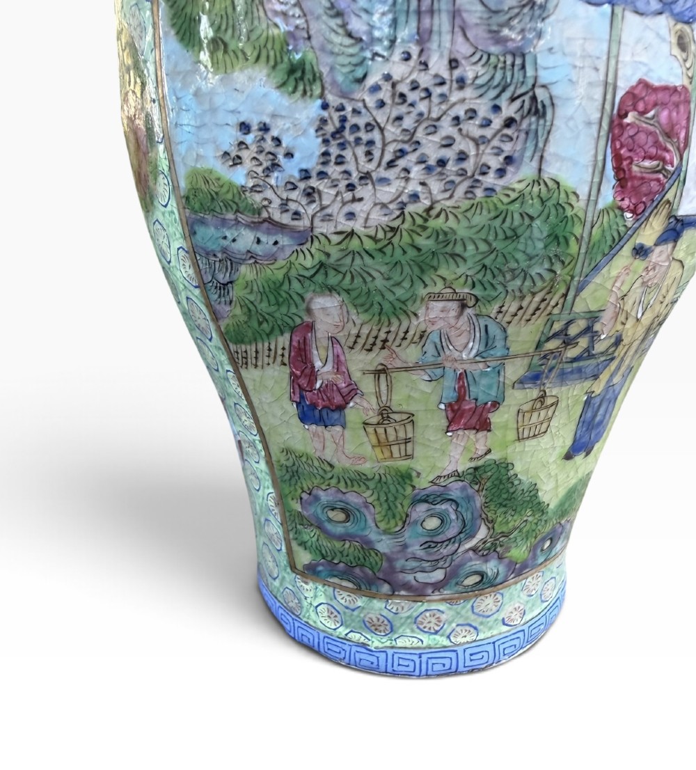 A pair of 19th-century Chinese Yixing stoneware baluster vases decorated in vibrant polychrome enamels with figural panels on a patterned green ground. View XIV