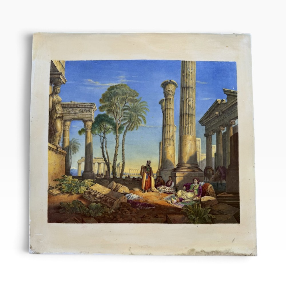 A square hand-painted English porcelain plaque depicting figures among classical ruins, set within a heavily molded gilt frame. View II
