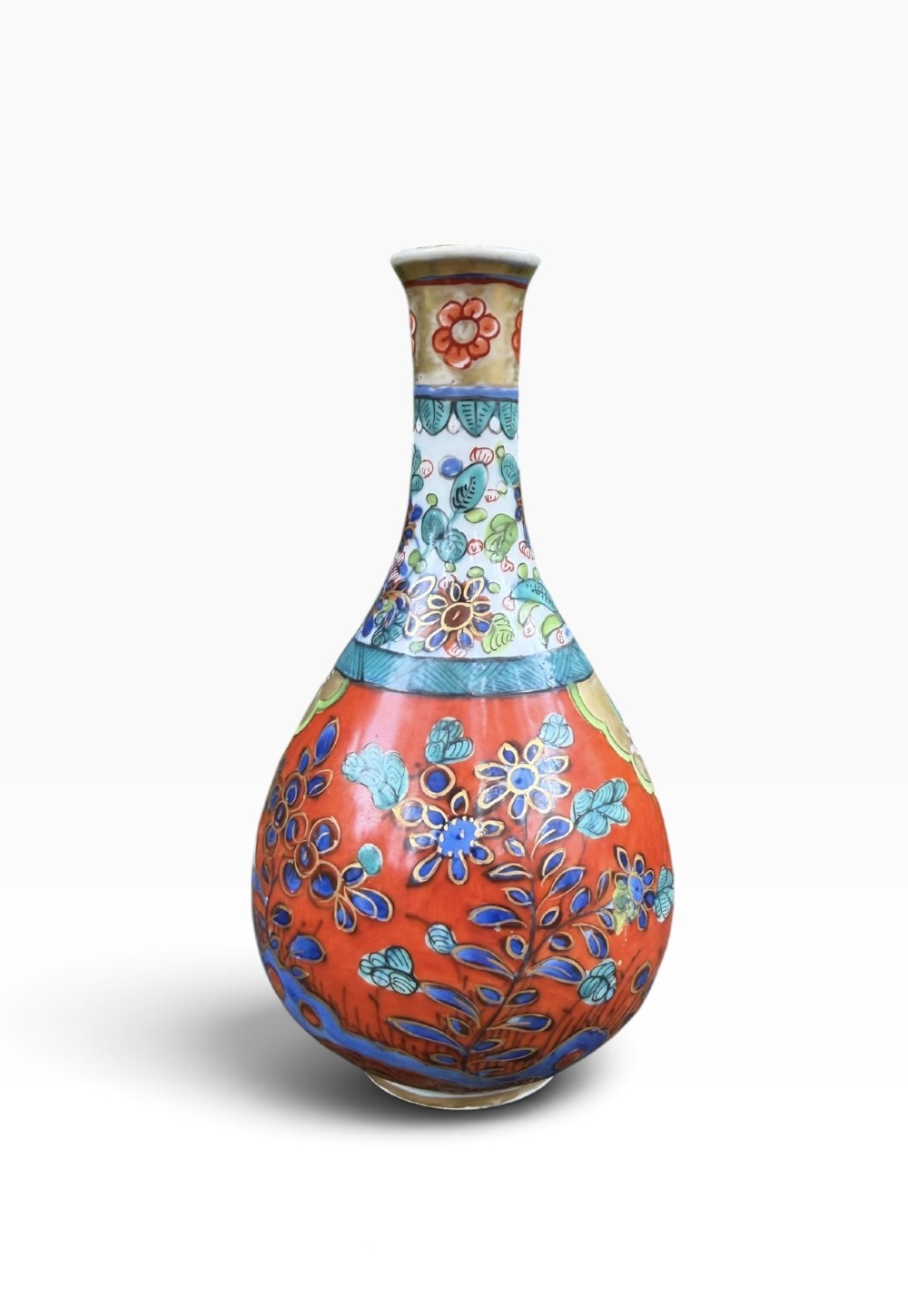 An antique pear-shaped Chinese clobbered porcelain vase featuring floral patterns in red, blue, green, and gold enamel.