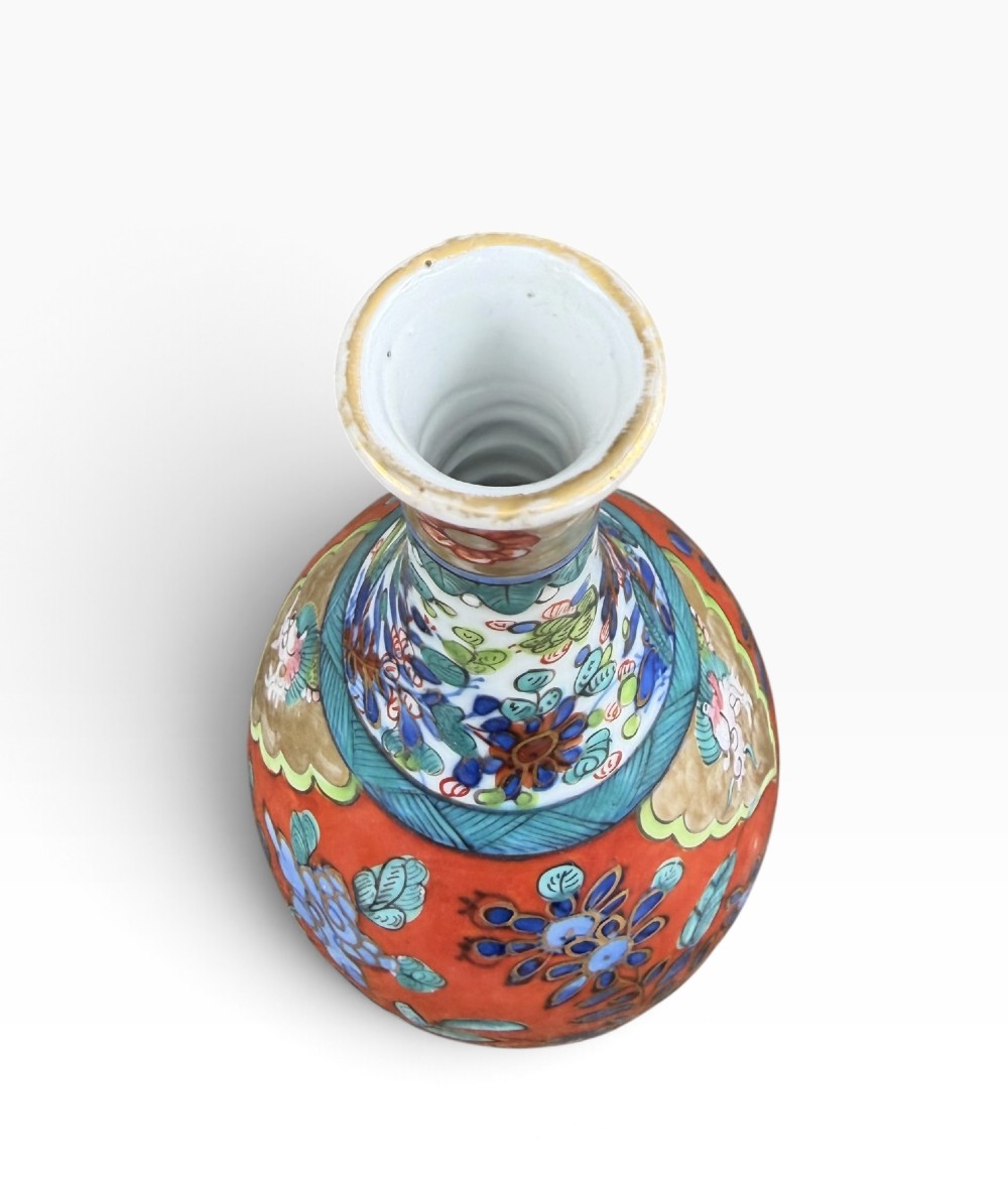 An antique pear-shaped Chinese clobbered porcelain vase featuring floral patterns in red, blue, green, and gold enamel. View IV