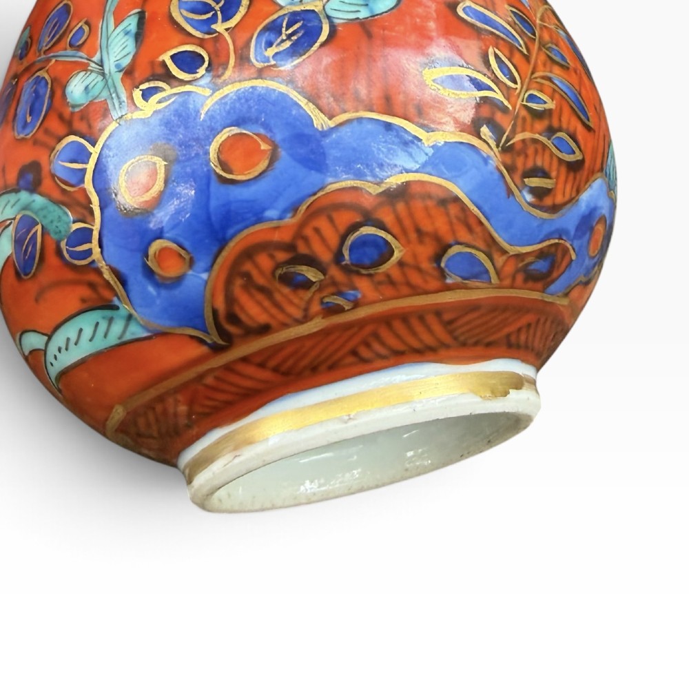 An antique pear-shaped Chinese clobbered porcelain vase featuring floral patterns in red, blue, green, and gold enamel. View VII