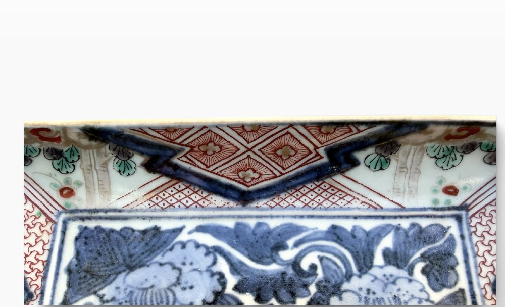A pair of rectangular Japanese Imari porcelain dishes decorated with central blue floral panels and geometric diaper borders. View III