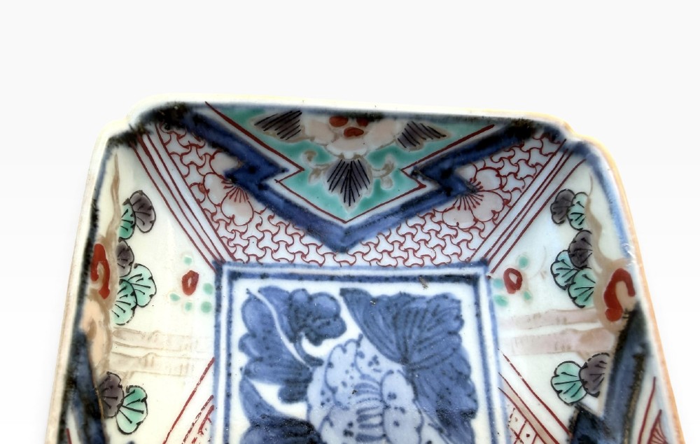 A pair of rectangular Japanese Imari porcelain dishes decorated with central blue floral panels and geometric diaper borders. View IV