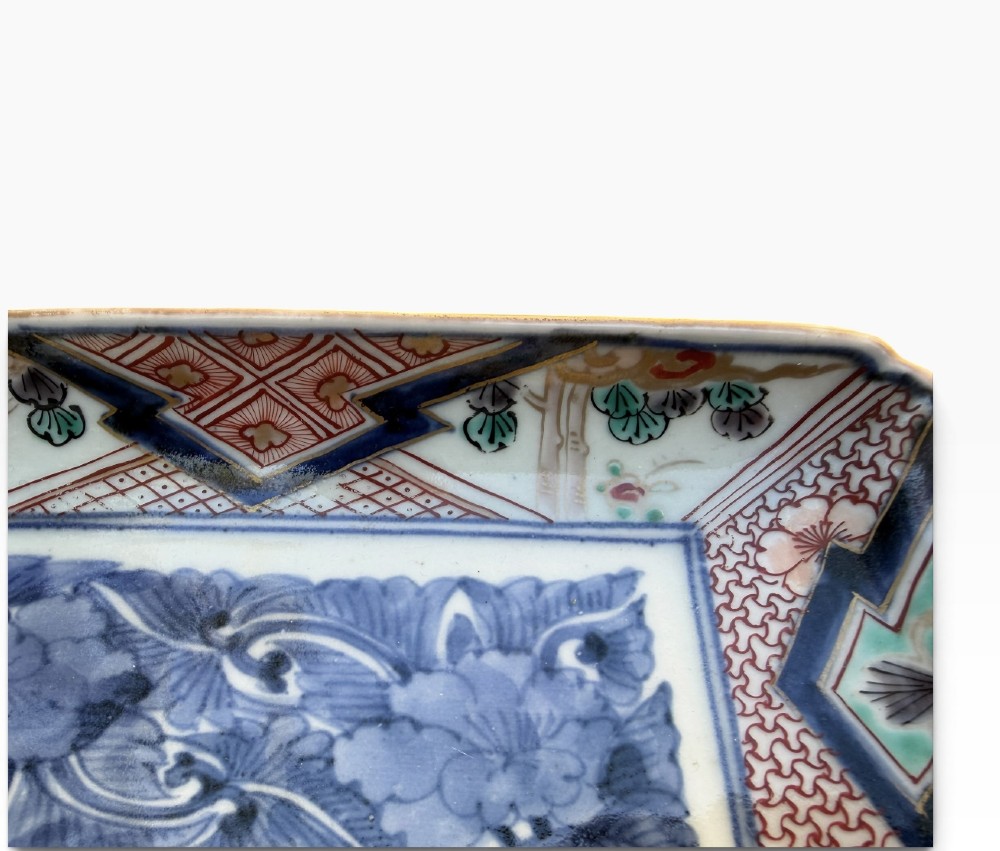 A pair of rectangular Japanese Imari porcelain dishes decorated with central blue floral panels and geometric diaper borders. View VIII