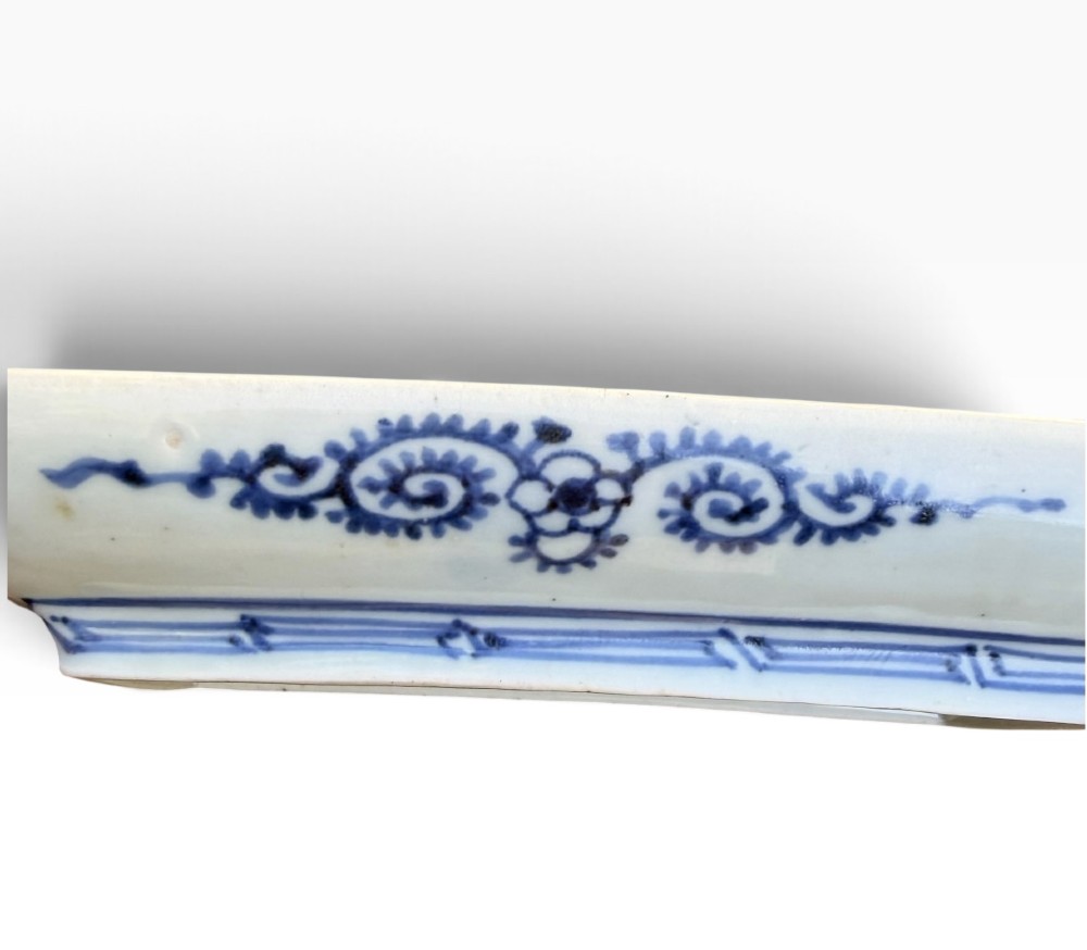 A pair of rectangular Japanese Imari porcelain dishes decorated with central blue floral panels and geometric diaper borders. View X
