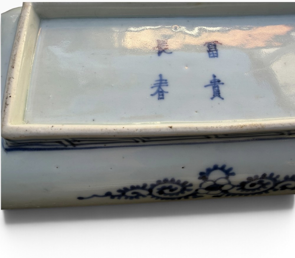 A pair of rectangular Japanese Imari porcelain dishes decorated with central blue floral panels and geometric diaper borders. View XII