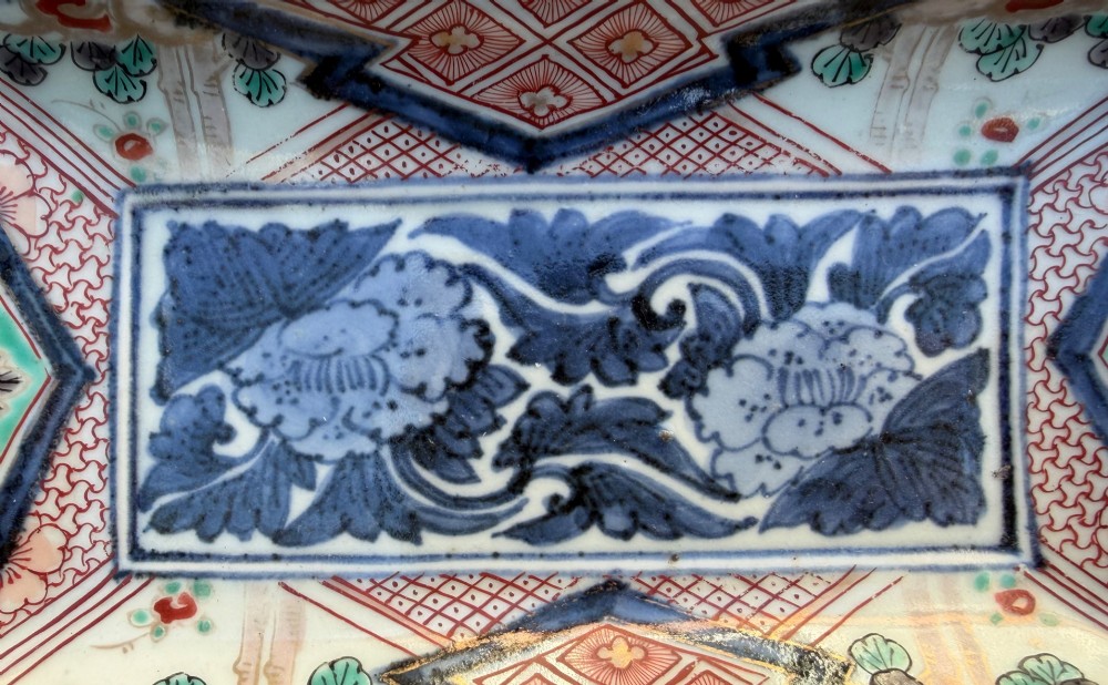 A pair of rectangular Japanese Imari porcelain dishes decorated with central blue floral panels and geometric diaper borders. View XIII