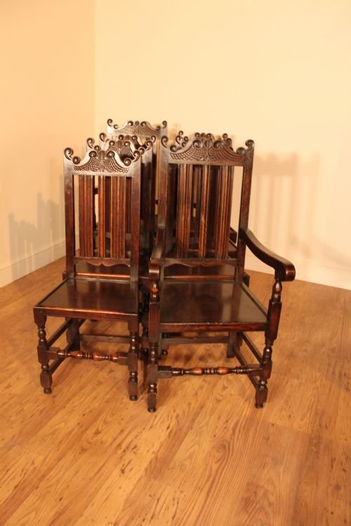 Interesting Harlequin Set of Carved Oak Chairs