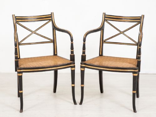 Pair of Regency Style Ebony and Gilt Open Arm Chairs