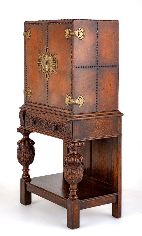 An Unusual Carved Oak and Leather Side Cabinet