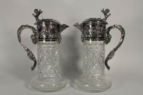 A Pair of Cut Glass and Silver Plate Portuguese Claret Jugs