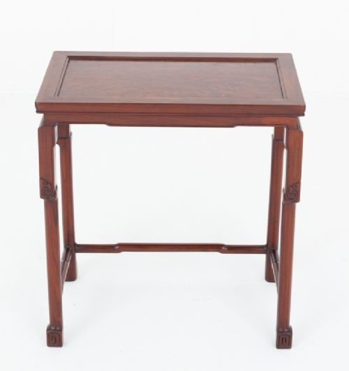fig 2. A rectangular Chinese style hardwood occasional table featuring carved corner spandrels, straight legs with low stretchers, and a framed top.