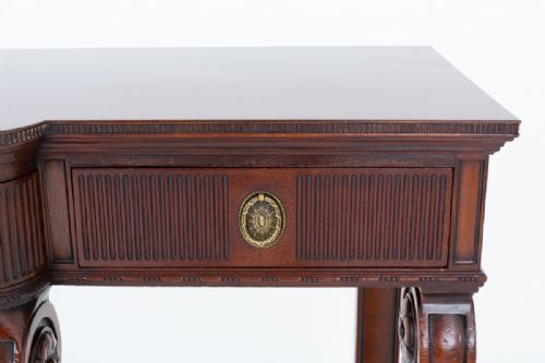 fig 1. A Georgian Revival mahogany server featuring three fluted front drawers with circular brass handles and four carved scroll legs.