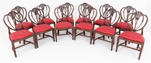 A SUPERB SET OF TWELVE MAHOGANY PRINCE OF WALES STYLE DINING CHAIRS