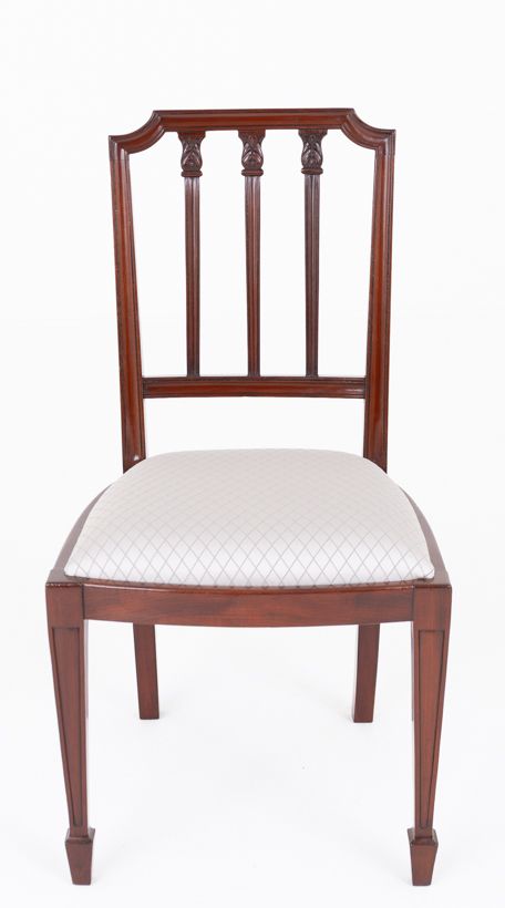 fig 2. A set of ten mahogany dining chairs featuring vertical splat backs, tapered legs with spade feet, and neutral patterned upholstered seats.
