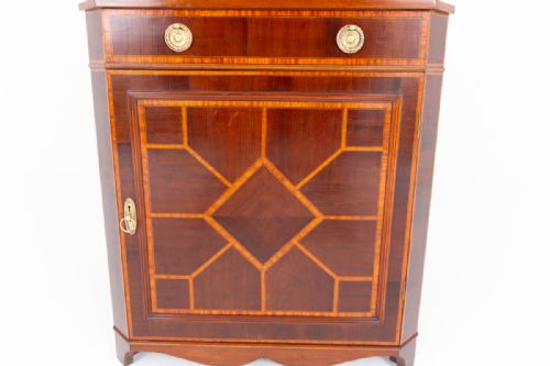 fig 1. A tall Sheraton Revival mahogany corner cabinet with an astragal glazed upper display section and a marquetry inlaid lower door panel.
