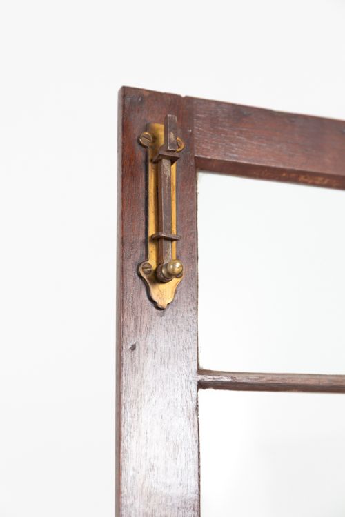 A mahogany Chippendale style glazed bookcase featuring geometric glass door panels, a carved frieze, and cabriole legs ending in ball and claw feet. View VIII