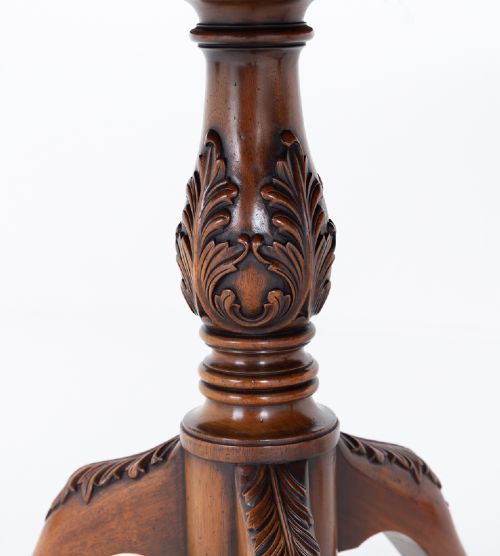 A Regency Revival twin-pedestal mahogany dining table featuring carved edging, turned support pillars, and splayed legs ending in carved feet. View V