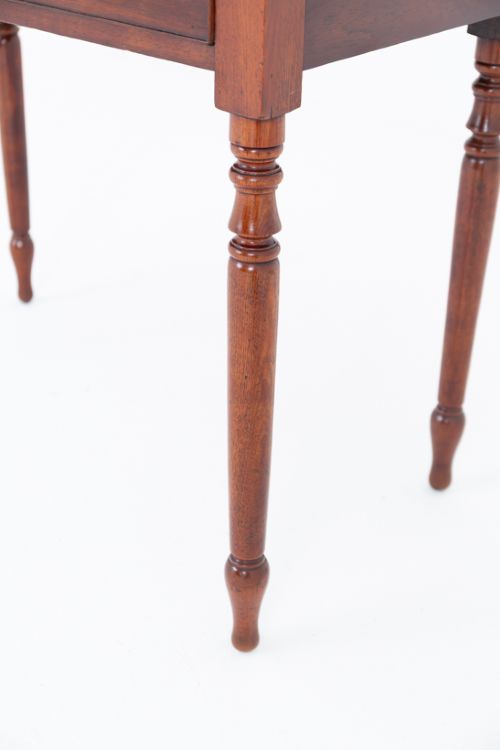 A Victorian mahogany side table featuring a rectangular top, a single frieze drawer with two dark turned knobs, and four slender turned legs. View III
