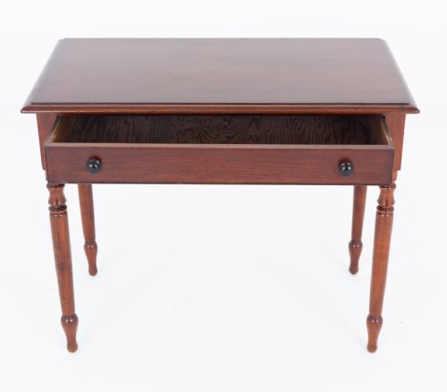 A Victorian mahogany side table featuring a rectangular top, a single frieze drawer with two dark turned knobs, and four slender turned legs. View IV