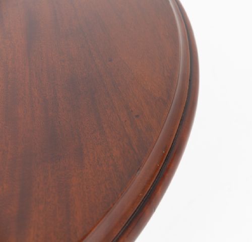 A William IV mahogany extending dining table supported by four reeded turned legs with brass castors. View IV