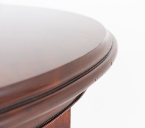 A William IV mahogany extending dining table supported by four reeded turned legs with brass castors. View V