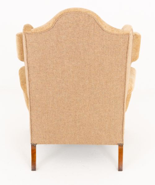 A pair of Georgian style wingback armchairs with tan textile upholstery, hump backs, shaped side wings, and walnut cabriole front legs. View IV