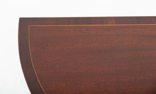 fig 1. A semicircular mahogany demi-lune console table featuring decorative wood inlay along the apron and top edge, supported by four slim tapered square legs.