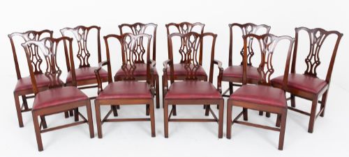 fig 1. A set of ten mahogany Chippendale style dining chairs with carved pierced back splats and red upholstered seats.