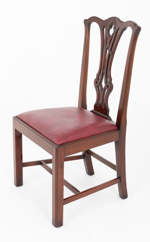 A set of ten mahogany Chippendale style dining chairs with carved pierced back splats and red upholstered seats. View VII