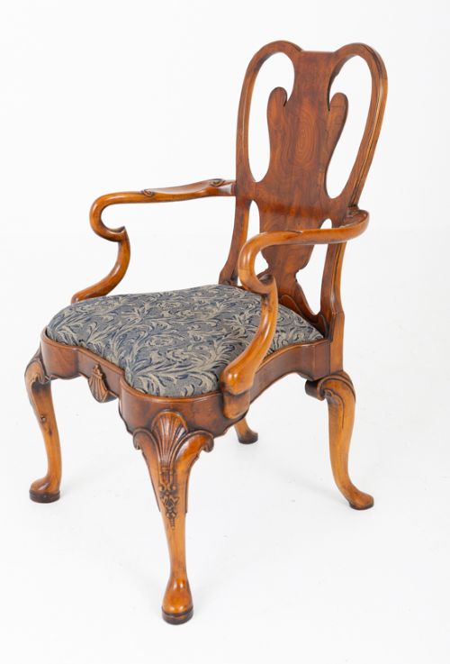 fig 4. A large set of twenty Queen Anne style elm dining chairs featuring shaped vasiform back splats, upholstered patterned seats, and cabriole legs with carved shell details.