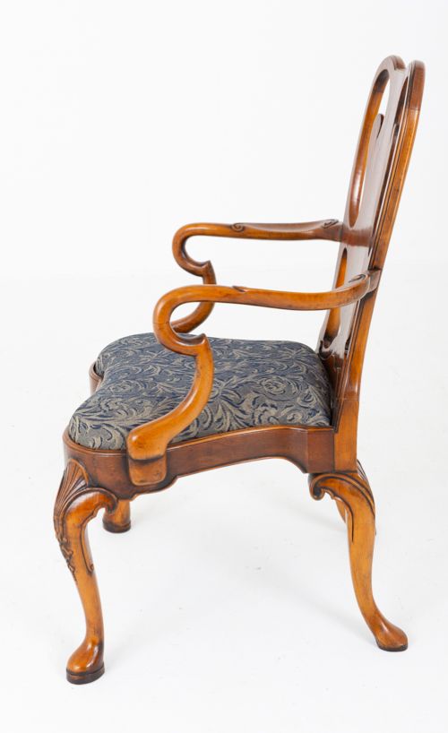 A large set of twenty Queen Anne style elm dining chairs featuring shaped vasiform back splats, upholstered patterned seats, and cabriole legs with carved shell details. View VI