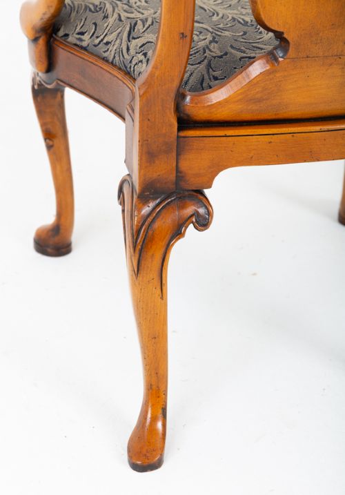A large set of twenty Queen Anne style elm dining chairs featuring shaped vasiform back splats, upholstered patterned seats, and cabriole legs with carved shell details. View VIII