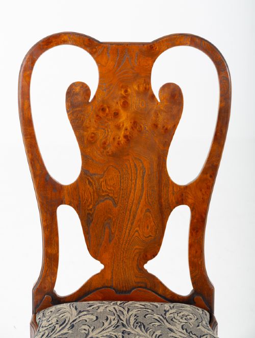 A large set of twenty Queen Anne style elm dining chairs featuring shaped vasiform back splats, upholstered patterned seats, and cabriole legs with carved shell details. View X