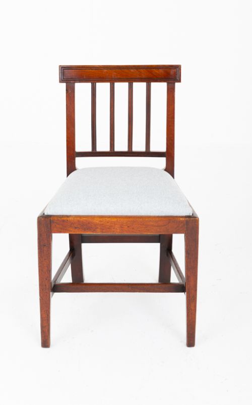 fig 1. Set of four Georgian mahogany dining chairs with rectangular bar backs, vertical splats, and light grey upholstered seats.