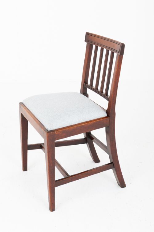 fig 2. Set of four Georgian mahogany dining chairs with rectangular bar backs, vertical splats, and light grey upholstered seats.