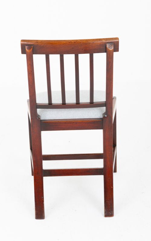 Set of four Georgian mahogany dining chairs with rectangular bar backs, vertical splats, and light grey upholstered seats. View V