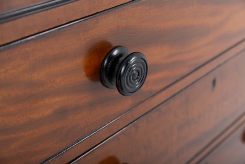 fig 1. A Regency mahogany cylinder bureau bookcase featuring Gothic astragal glazed upper doors above a curved roll-top desk and three long drawers with turned dark handles.