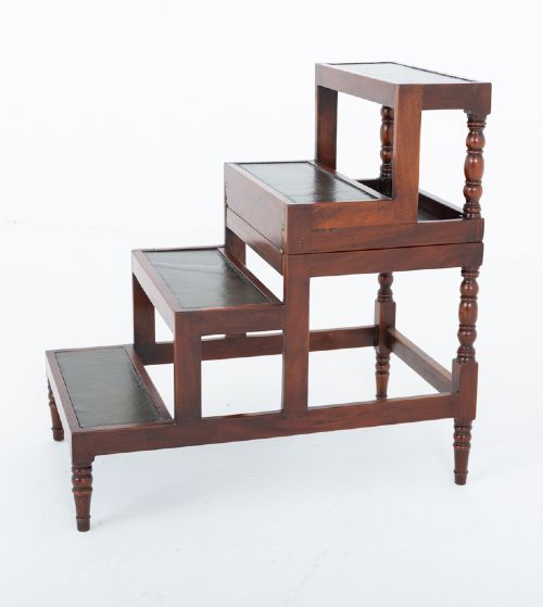 fig 1. A four-tier mahogany library step structure featuring dark leather-lined treads and turned wooden spindle legs.