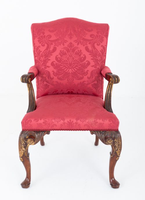 fig 1. A Chippendale style armchair upholstered in red damask fabric with carved mahogany cabriole legs and parcel-gilt detailing.