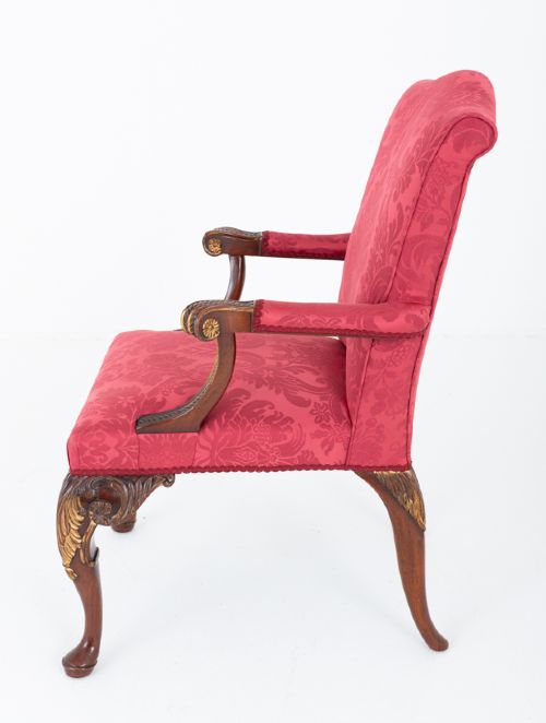A Chippendale style armchair upholstered in red damask fabric with carved mahogany cabriole legs and parcel-gilt detailing. View V