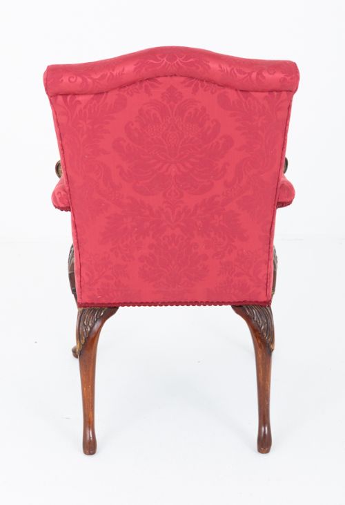 A Chippendale style armchair upholstered in red damask fabric with carved mahogany cabriole legs and parcel-gilt detailing. View VI