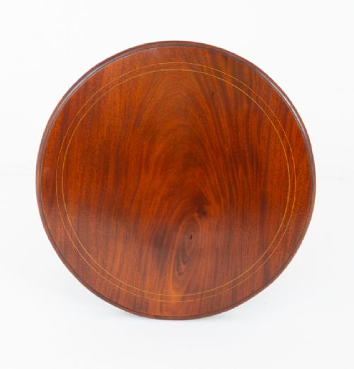 A circular mahogany occasional table featuring four flared legs joined by a central lower circular tier. View V