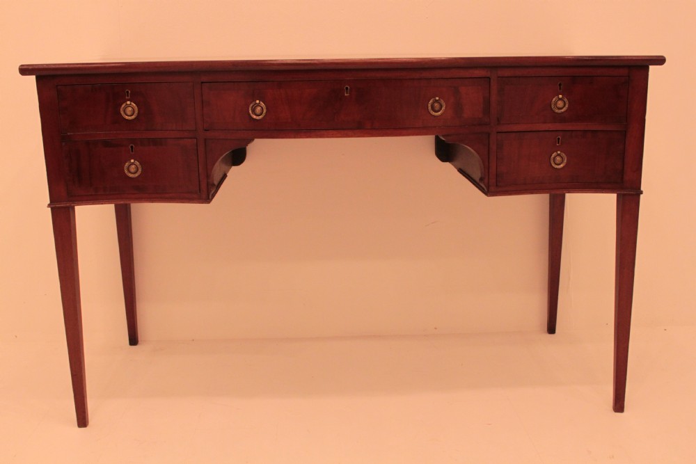 Mahogany Serpentine sideboard in the Sheraton style