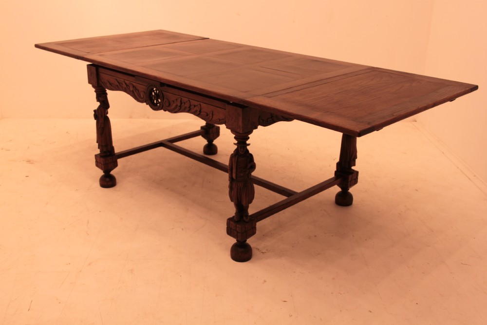 A Highly Unusual French oak Draw Leaf Dining Table