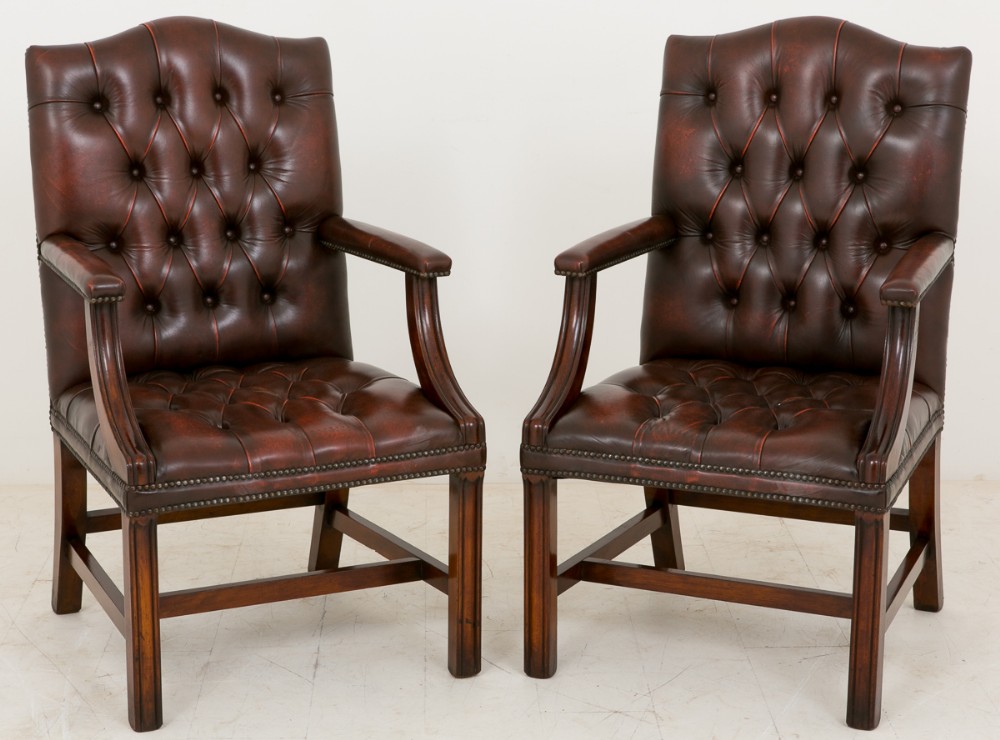Matching pair of deep buttoned leather Gainsborough Chairs