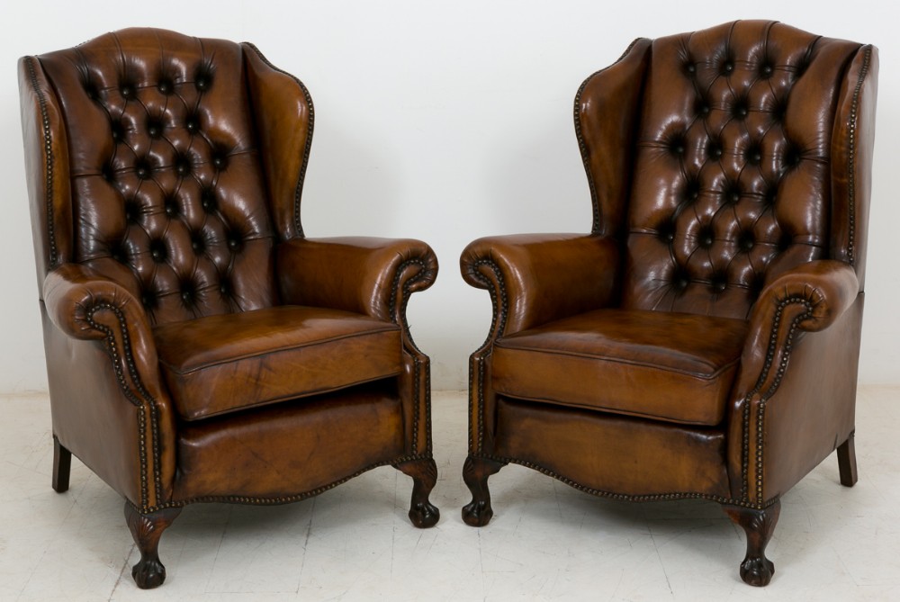 Pair of Leather Deep Buttoned Wing Chairs