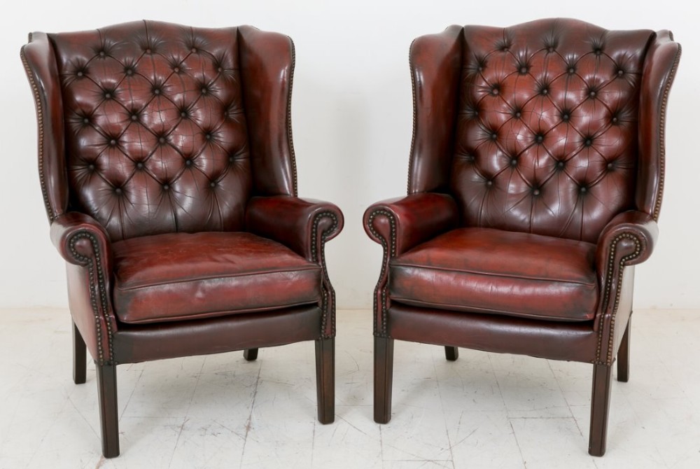 Pair of Leather Deep Buttoned Wing Chairs